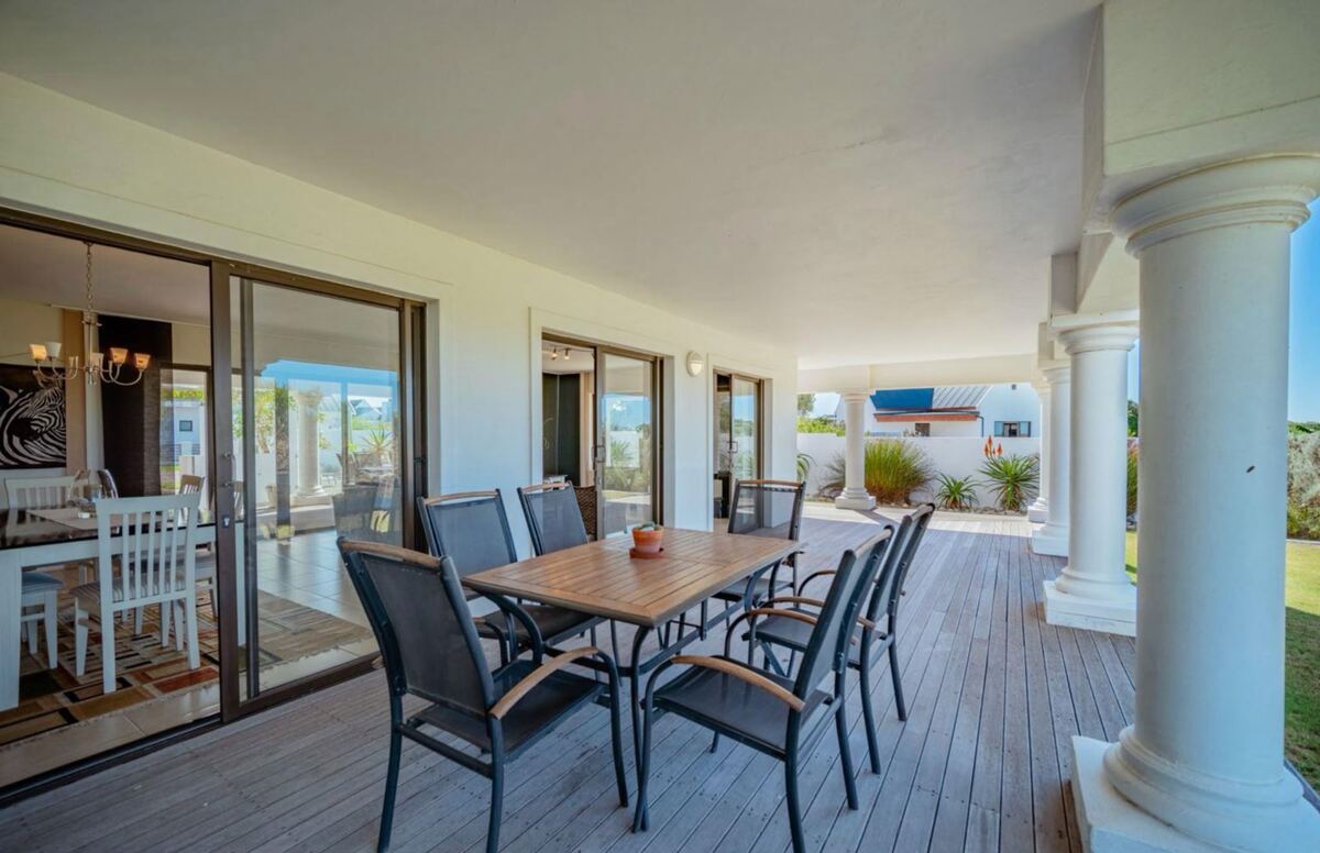 Outdoor dining table for eight on the covered deck