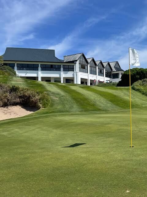 The St Francis Links clubhouse above a green
